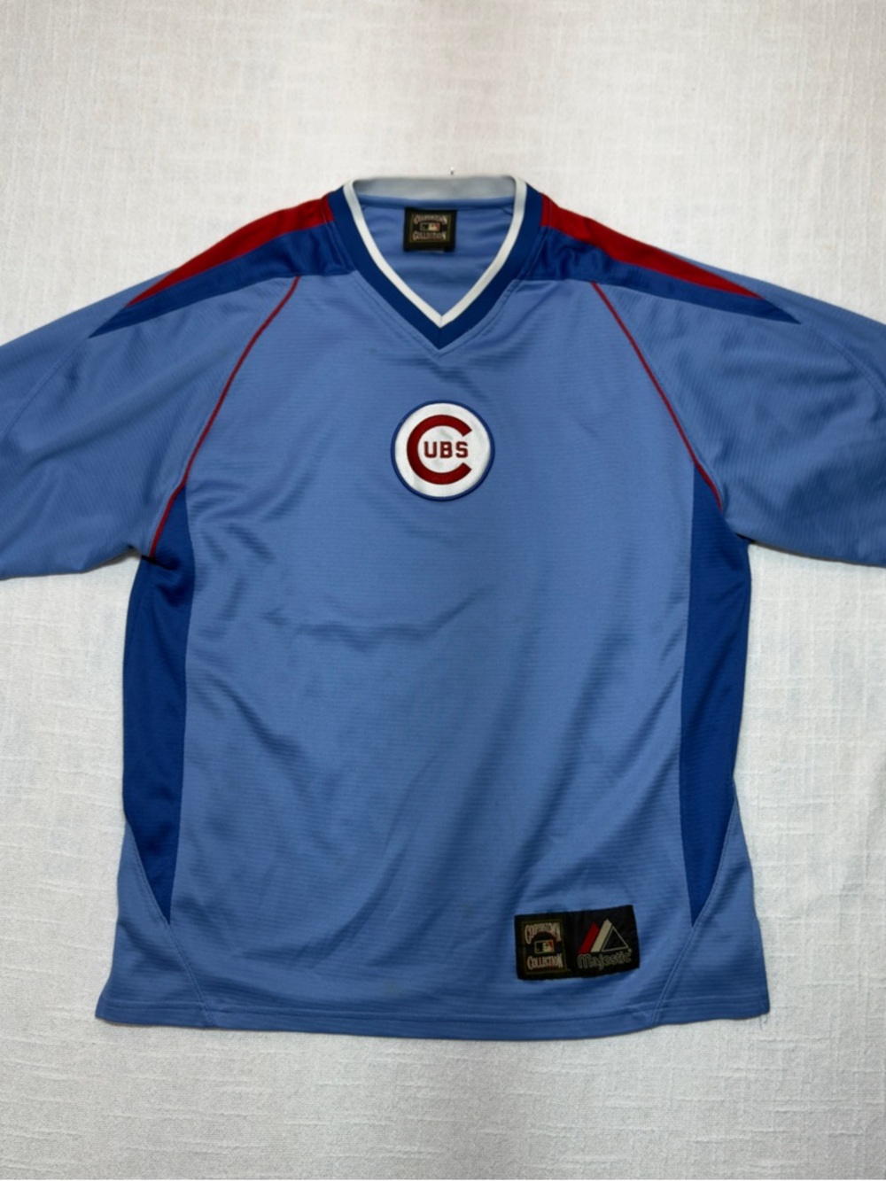 Majestic Light Blue Athletic Jersey with Navy and Red Logo Accents